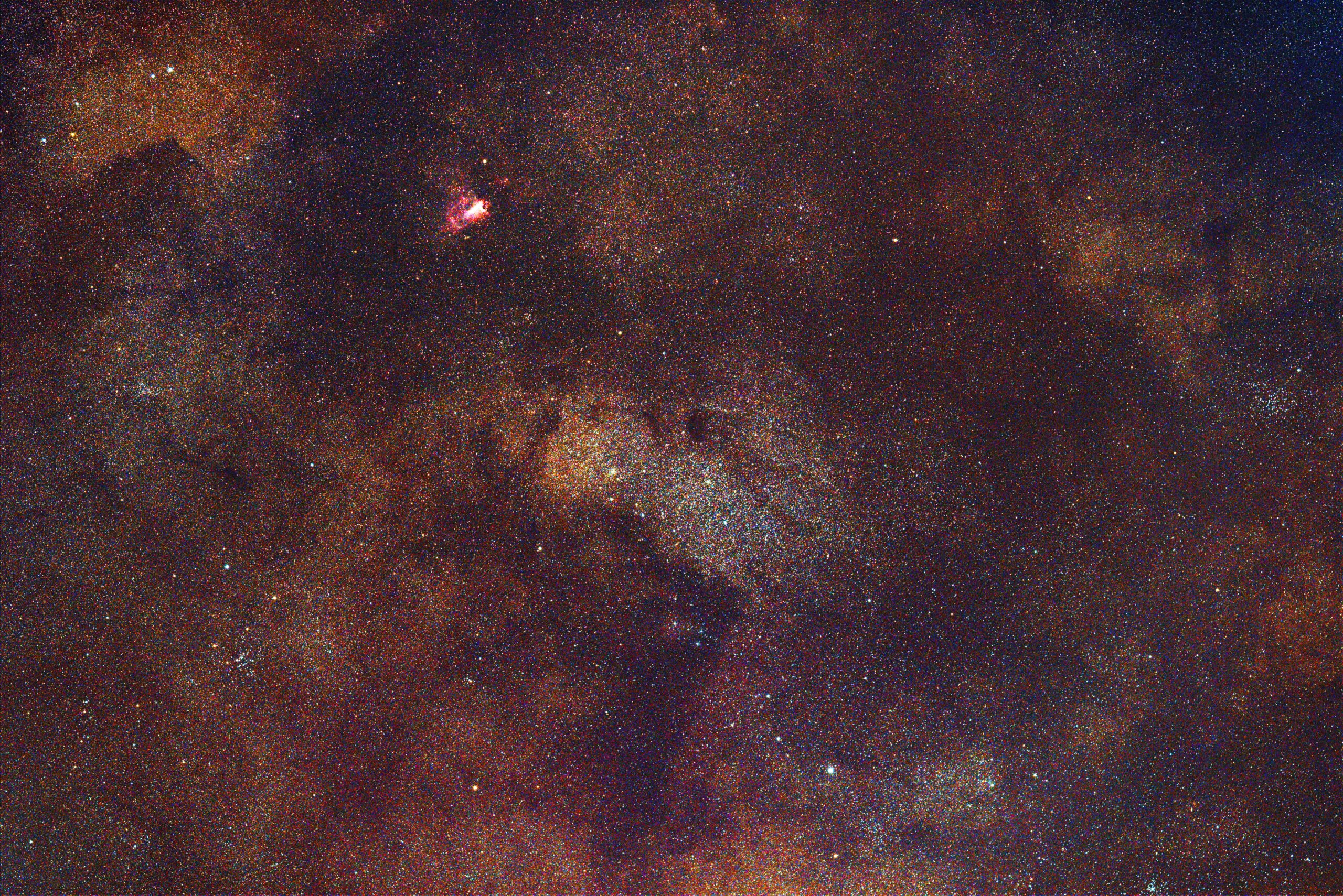 Swan Nebula and Small Saggitarius Star Cloud photographed with Rokinon/Samyang 135mm f/2 lens.